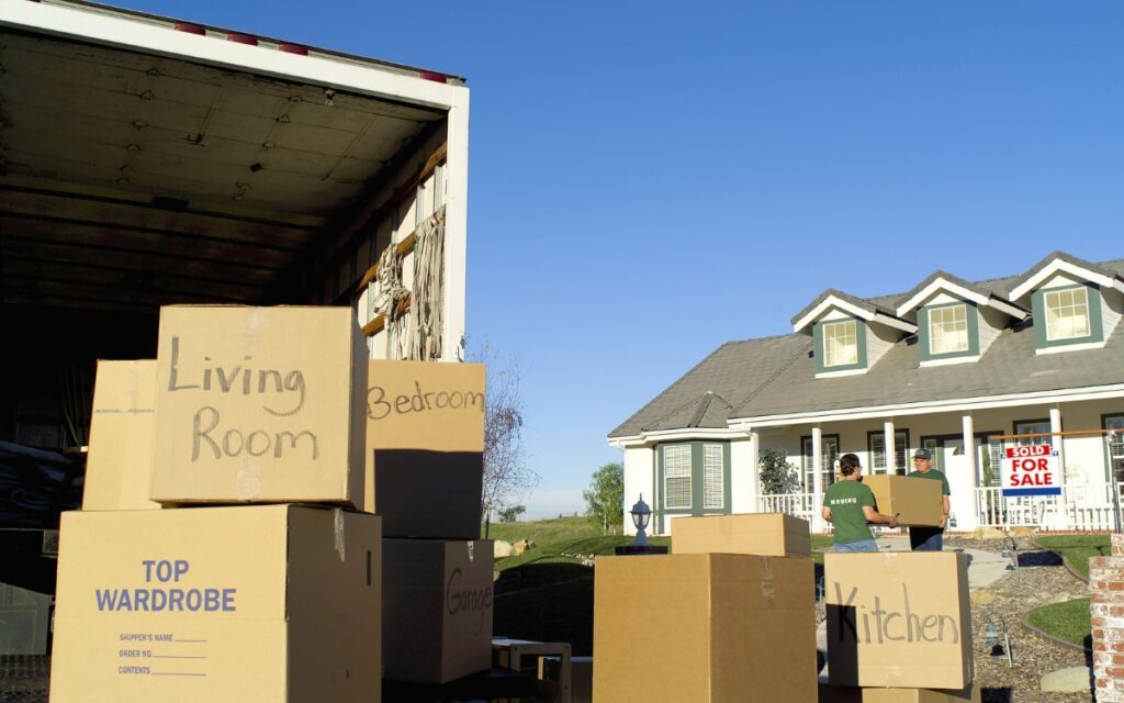 moving truck and boxes outside house